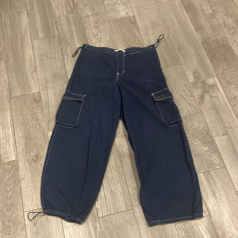 Navy blue, adjustable, cargo pants.